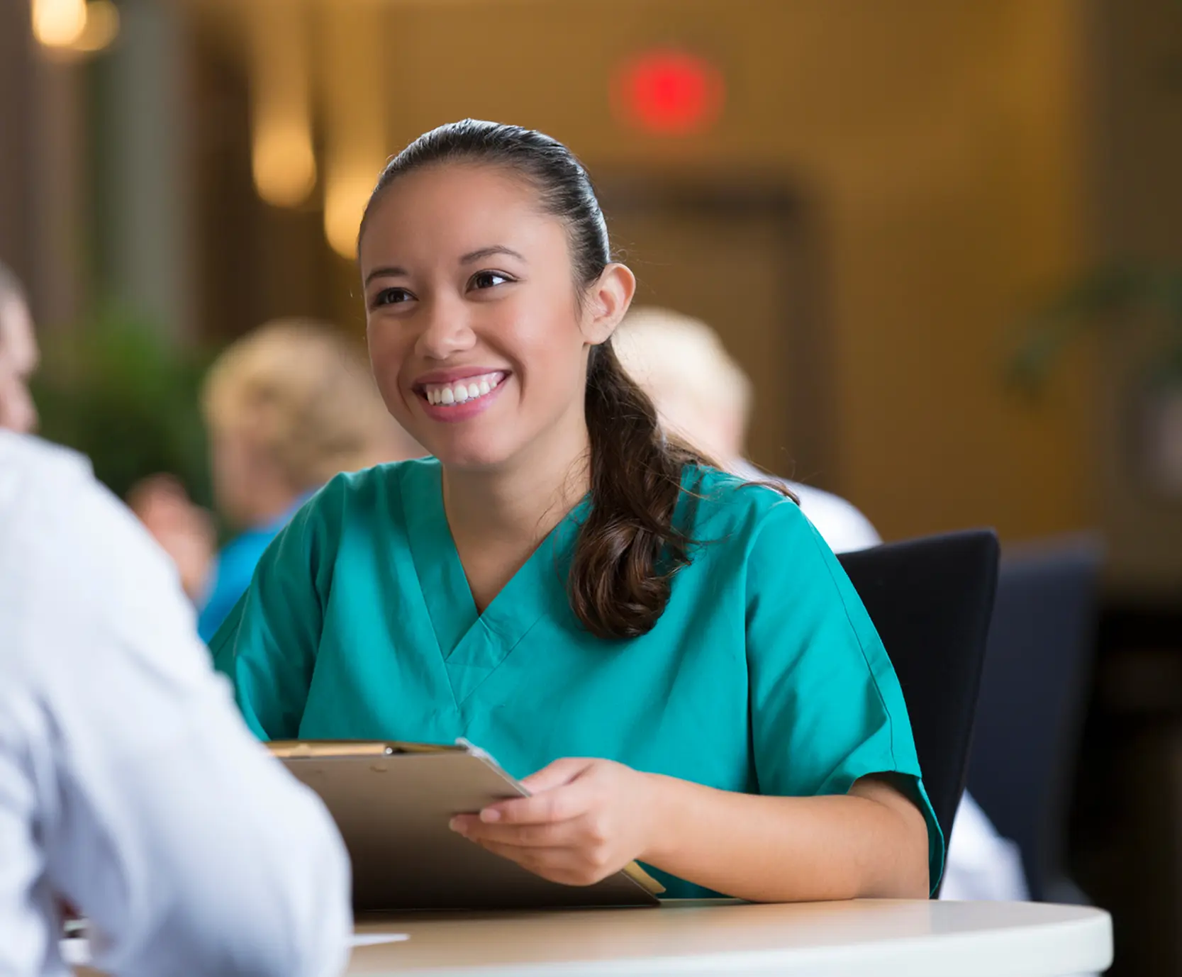 Healthcare professional talking to patient