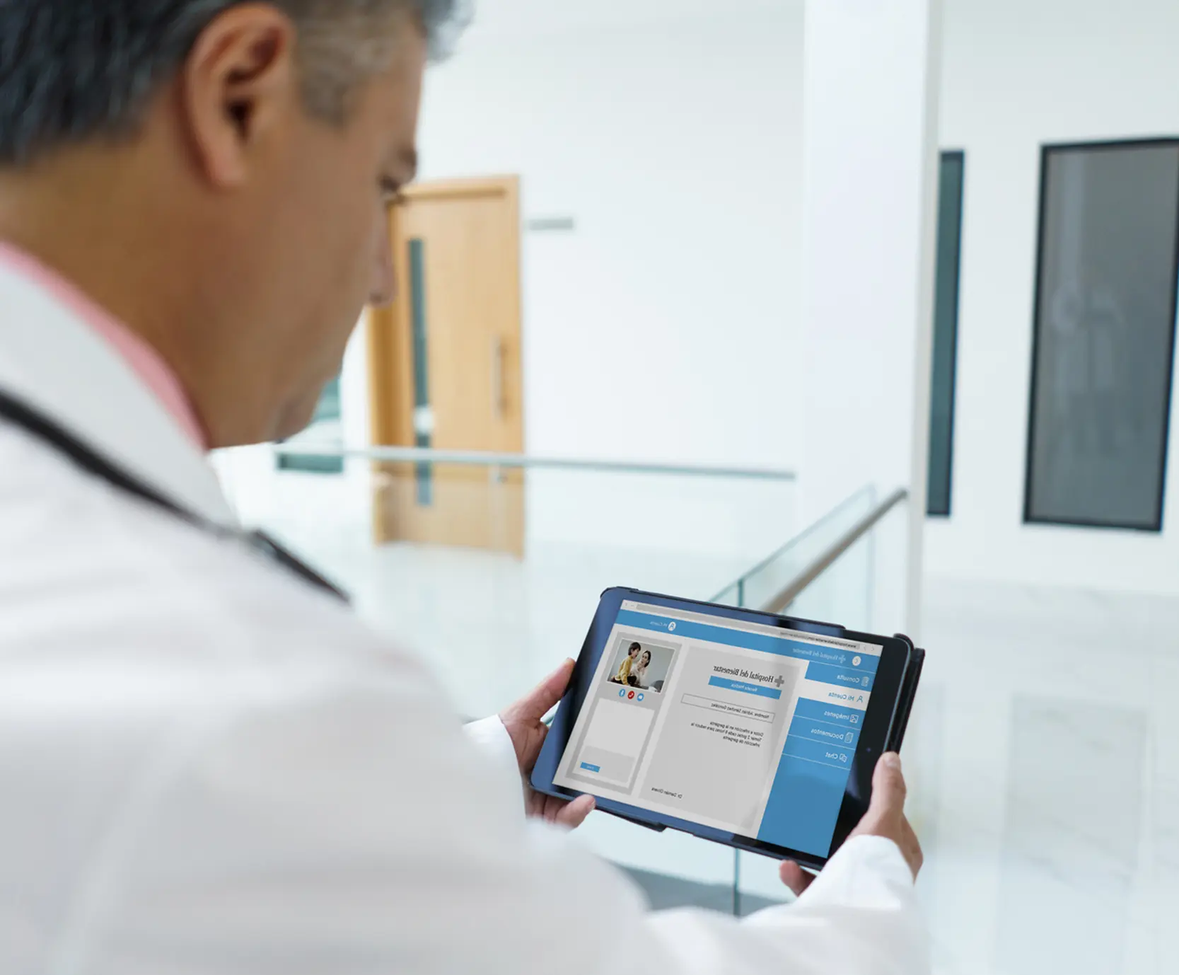 Healthcare worker checking data on electronic device