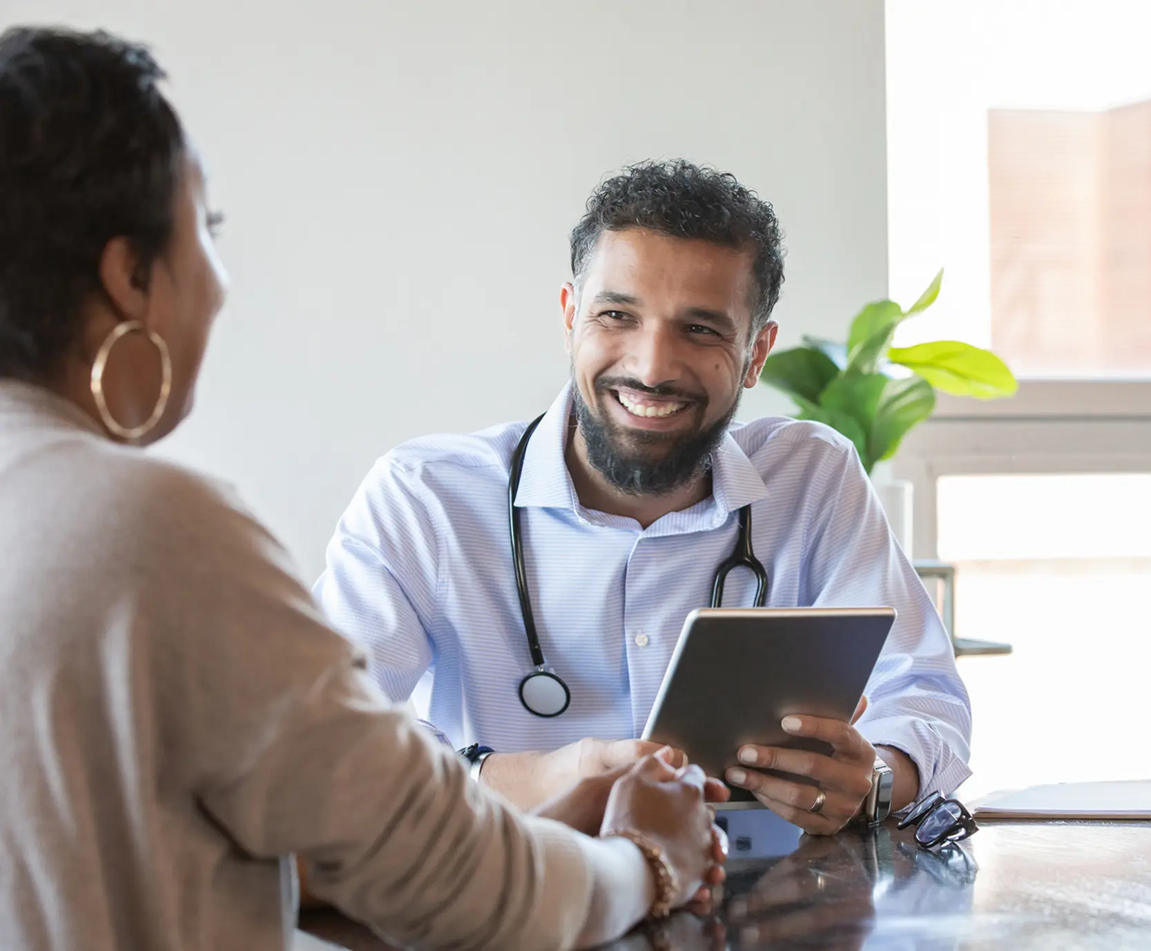 Medical professional discussing health with patient