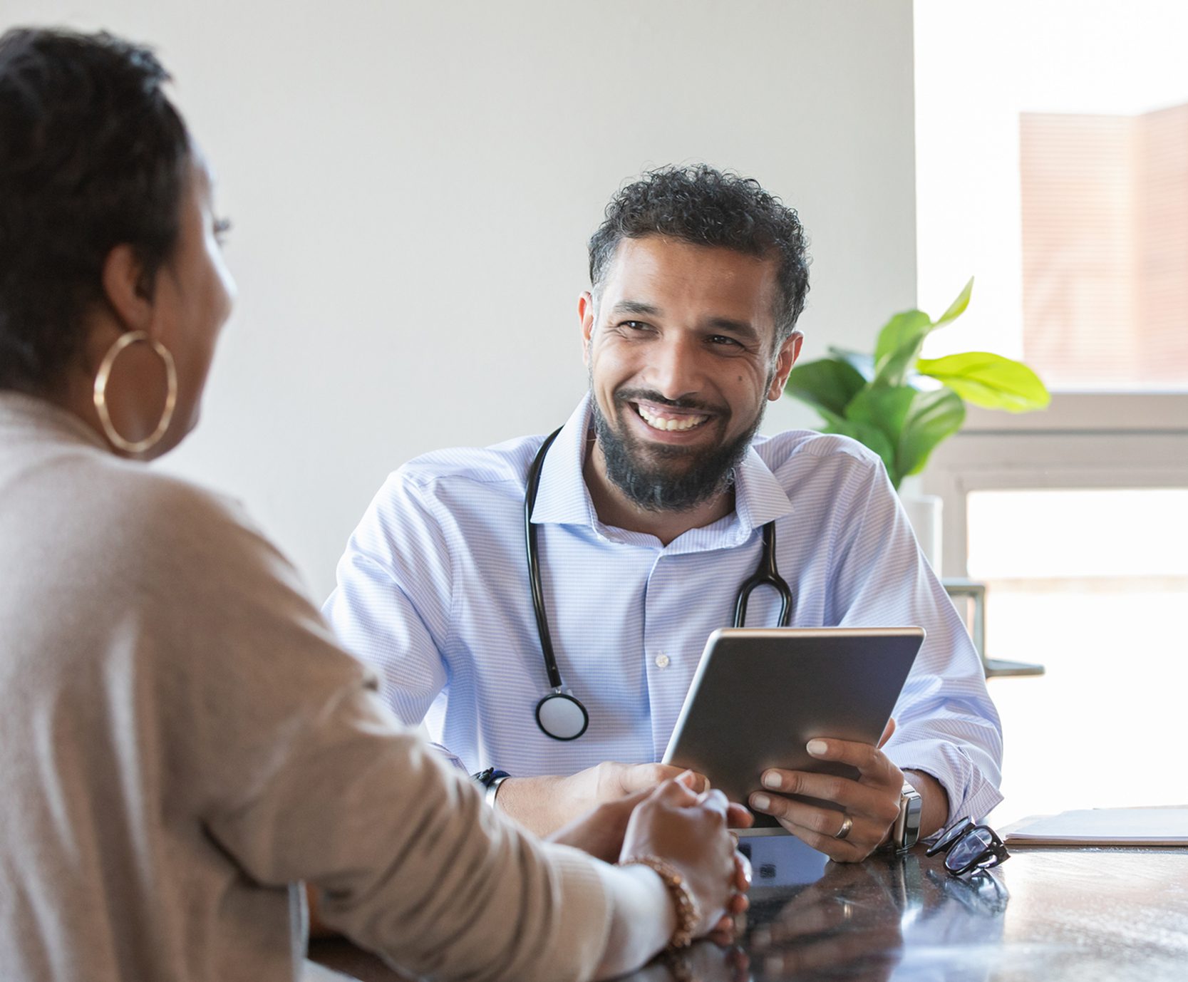 Medical professional discussing health with patient